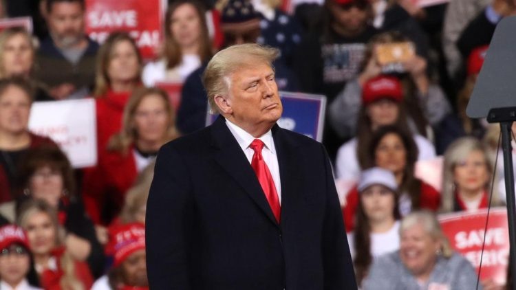    VALDOSTA, GEORGIA - DECEMBER 05: President Donald Trump attends a rally in support of Sen. David Perdue (R-GA) and Sen. Kelly Loeffler (R-GA) on December 05, 2020 in Valdosta, Georgia. The rally with the senators comes ahead of a crucial runoff election for Perdue and Loeffler on January 5th which will decide who controls the United States senate. (Photo by Spencer Platt/Getty Images) Anush - Test