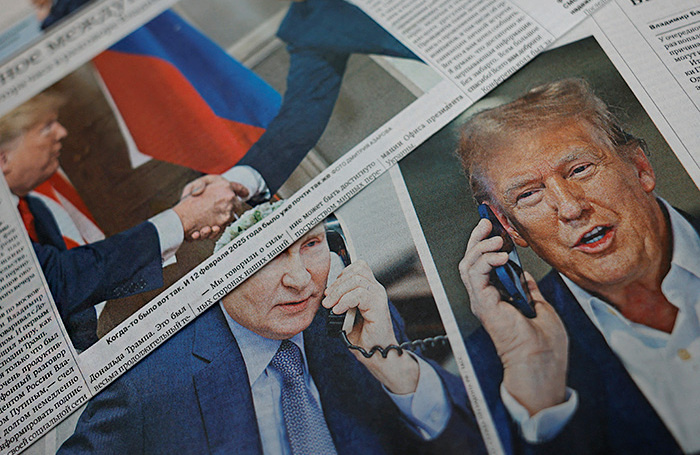    Статьи о диалоге Владимира Путина и Дональда Трампа. Архив.REUTERS/Максим Шеметов