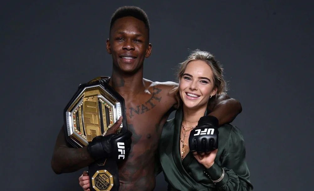     Исраэль Адесанья и Шарлотта Паудрелл