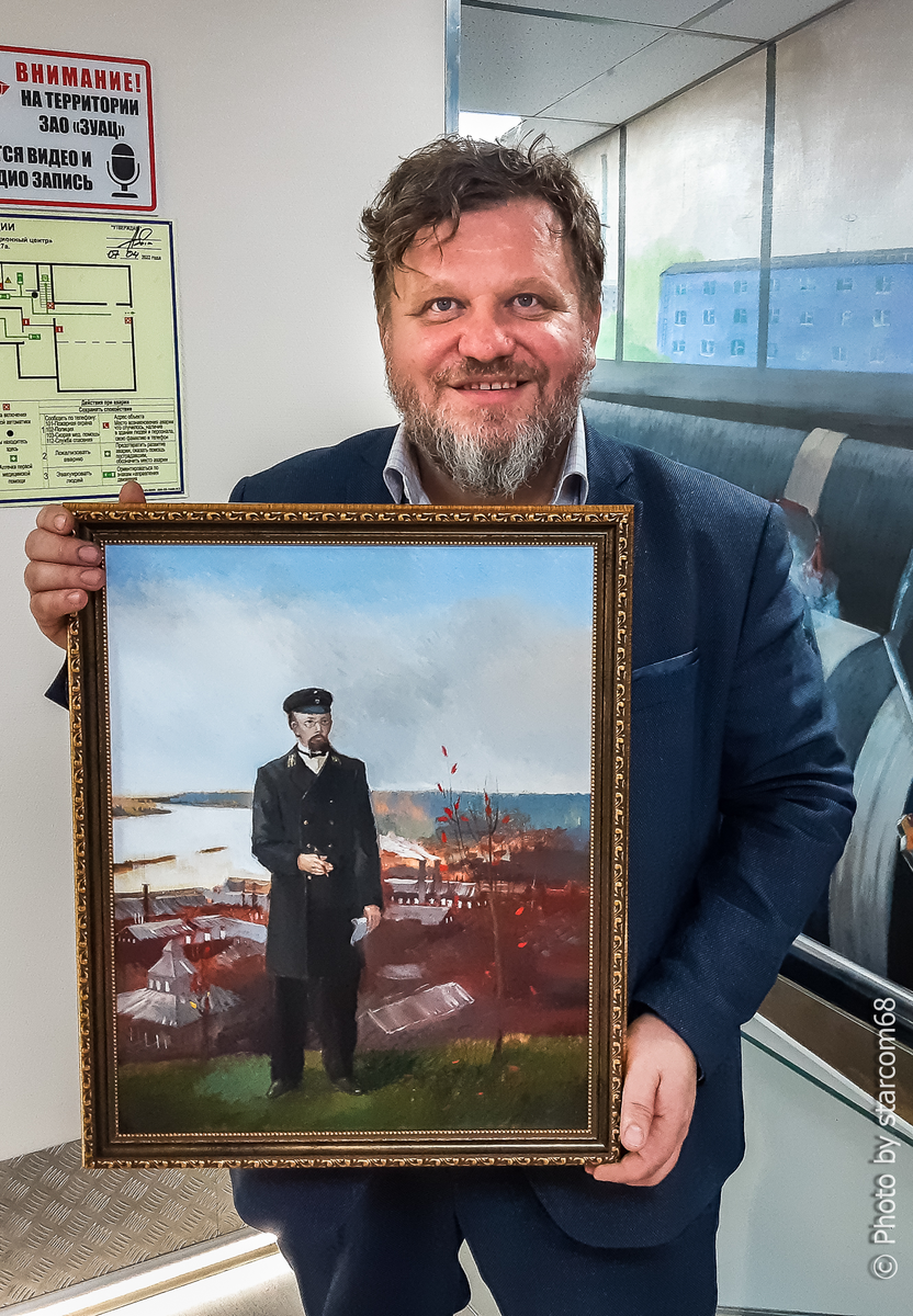 Алексей Сигаев с портретом Н.Г.Славянова в офисе ЗУАЦ
