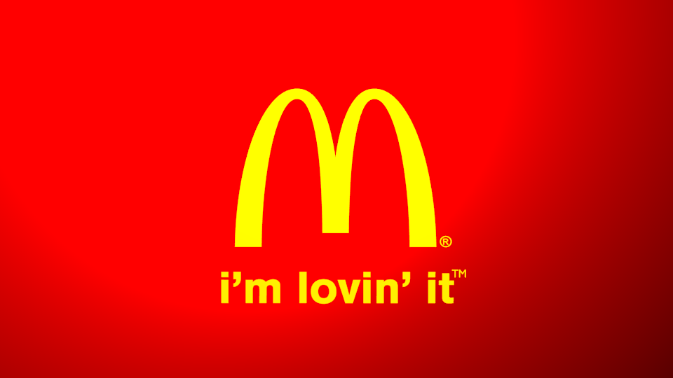 Билборд с известным слоганом компании. Источник: Wikipedia.org