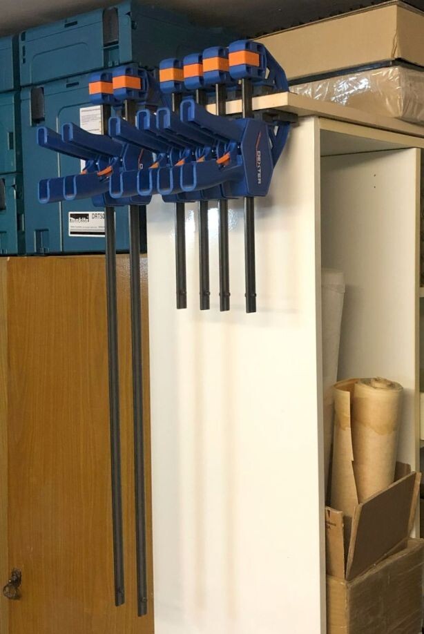 Глухой торец шкафа/стеллажа - отличный кандидат. Главное воздержаться от крепления на фасадах, перекрывая доступ к полкам.