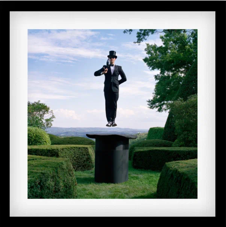    Rodney Smith, Reed Floating above Giant Top Hat with Umbrella, New York, 2014