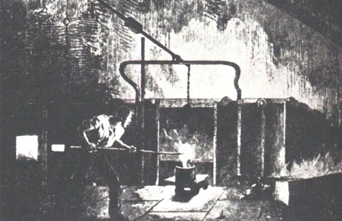 Рабочий у пудлинговой печи.