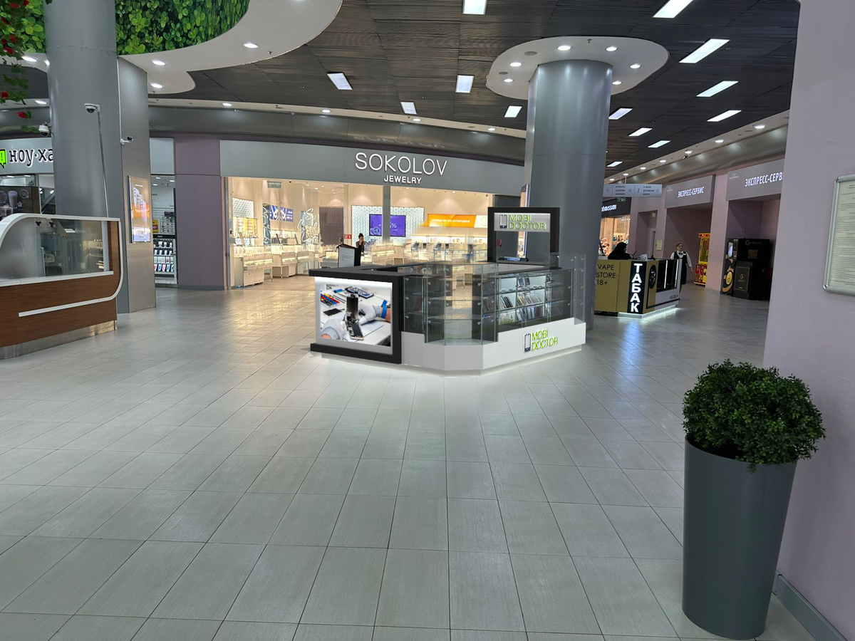 Удачное расположение торгового острова на пересечении нескольких потоков. На фото пример торгового острова по продаже аксессуаров и ремонта мобильных телефонов. Автор проекта ООО Додель dodele.ru