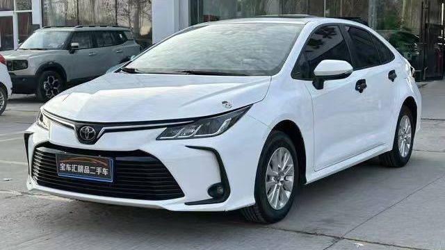 Toyota Corolla E210 вид спереди 