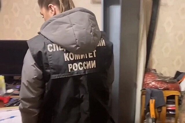   Следователи в квартире стрелка. Фото: кадр из видео