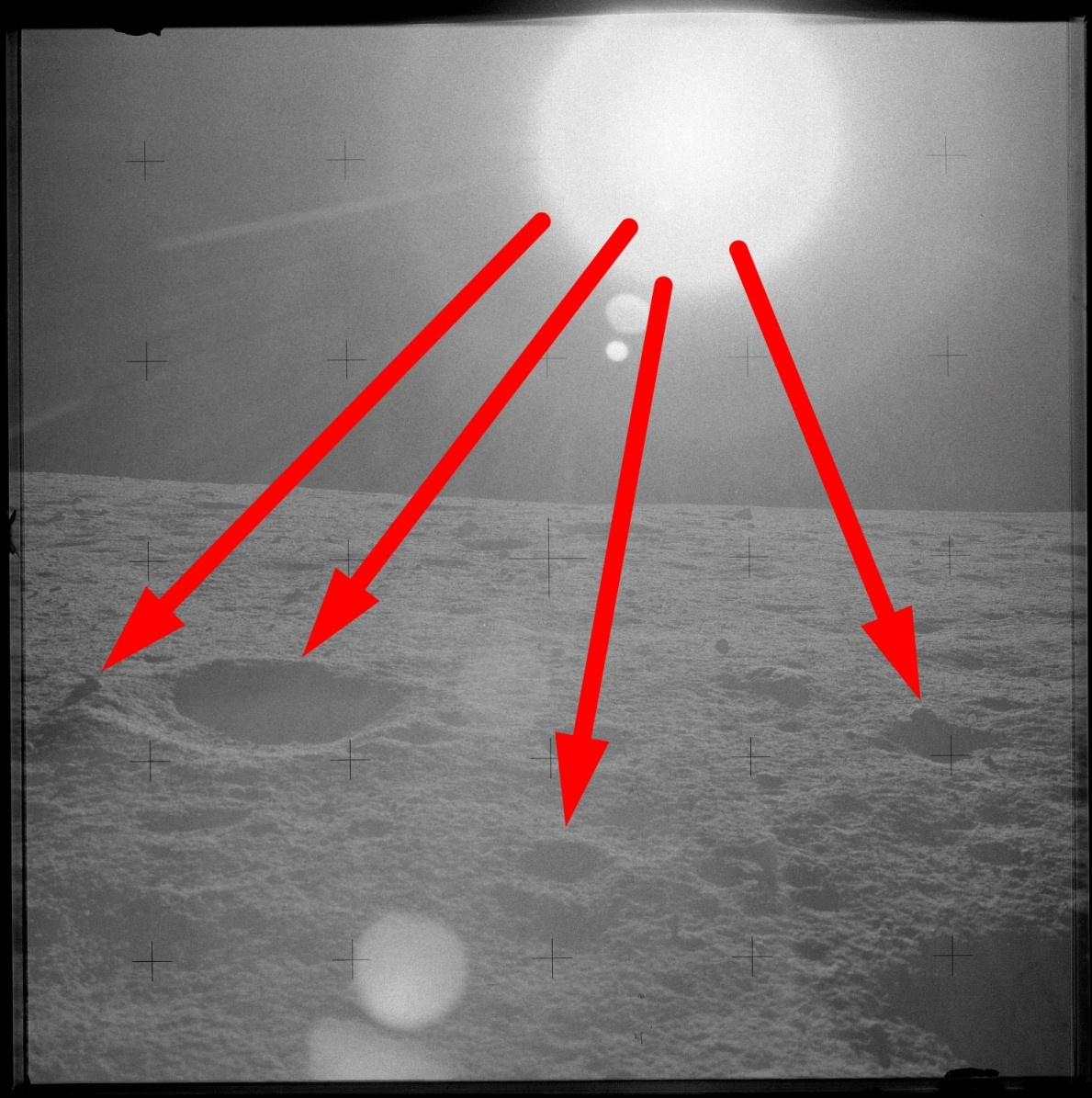 Здесь тени от прожектора падают,разумеется, в противоположную от источника освещения сторону. Это якобы снимок, сделанный на Луне.