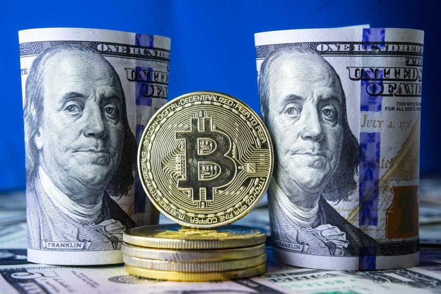 Криптовалюта биткойн (иллюстрация)   Роман Пименов/ТАСС