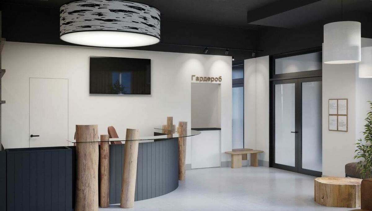 Дерево в интерьере сочетается с современными деталями - электронными табло и телевизорами