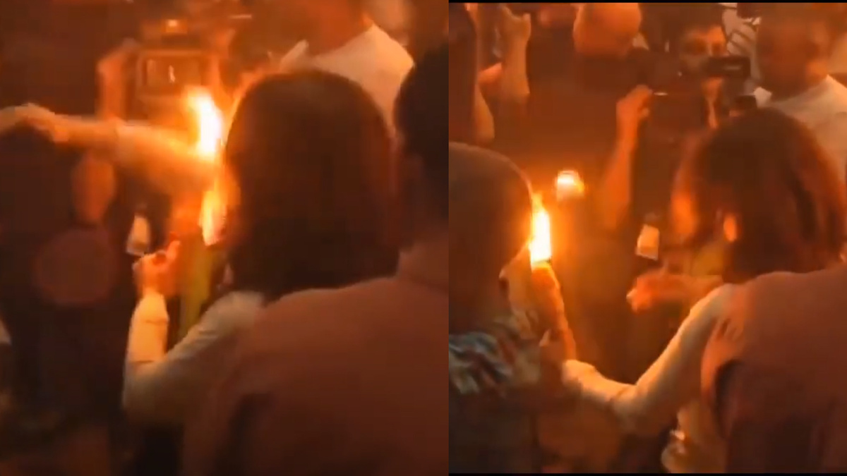 Момент, где у женщины загораются волосы. Она их сразу потушила. На видео это лучше видео.