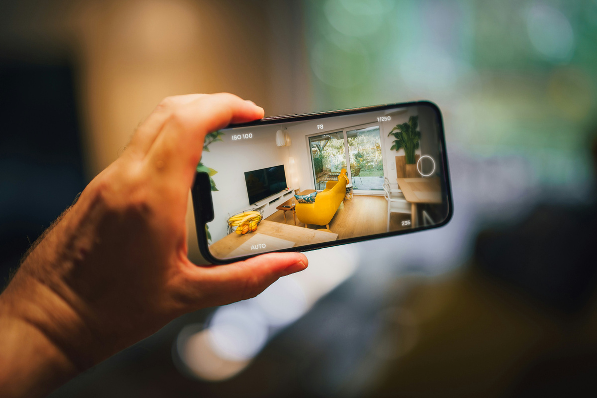 https://unsplash.com/photos/a-person-taking-a-picture-of-a-living-room-kERJK6vLRMw 