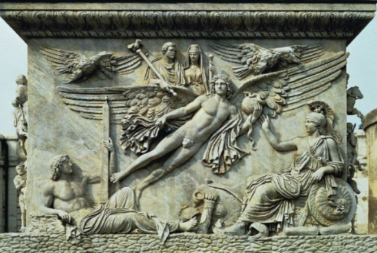 Рис. 2. Апофеоз (обожествление) императора Антонина Пия и его супруги Фаустины. Рельеф на лицевой стороне цоколя колонны Антонина Пия (161 г. н.э.). Ватикан. Рим. Рельеф изображает вознесение крылатым гением императорской четы на небо