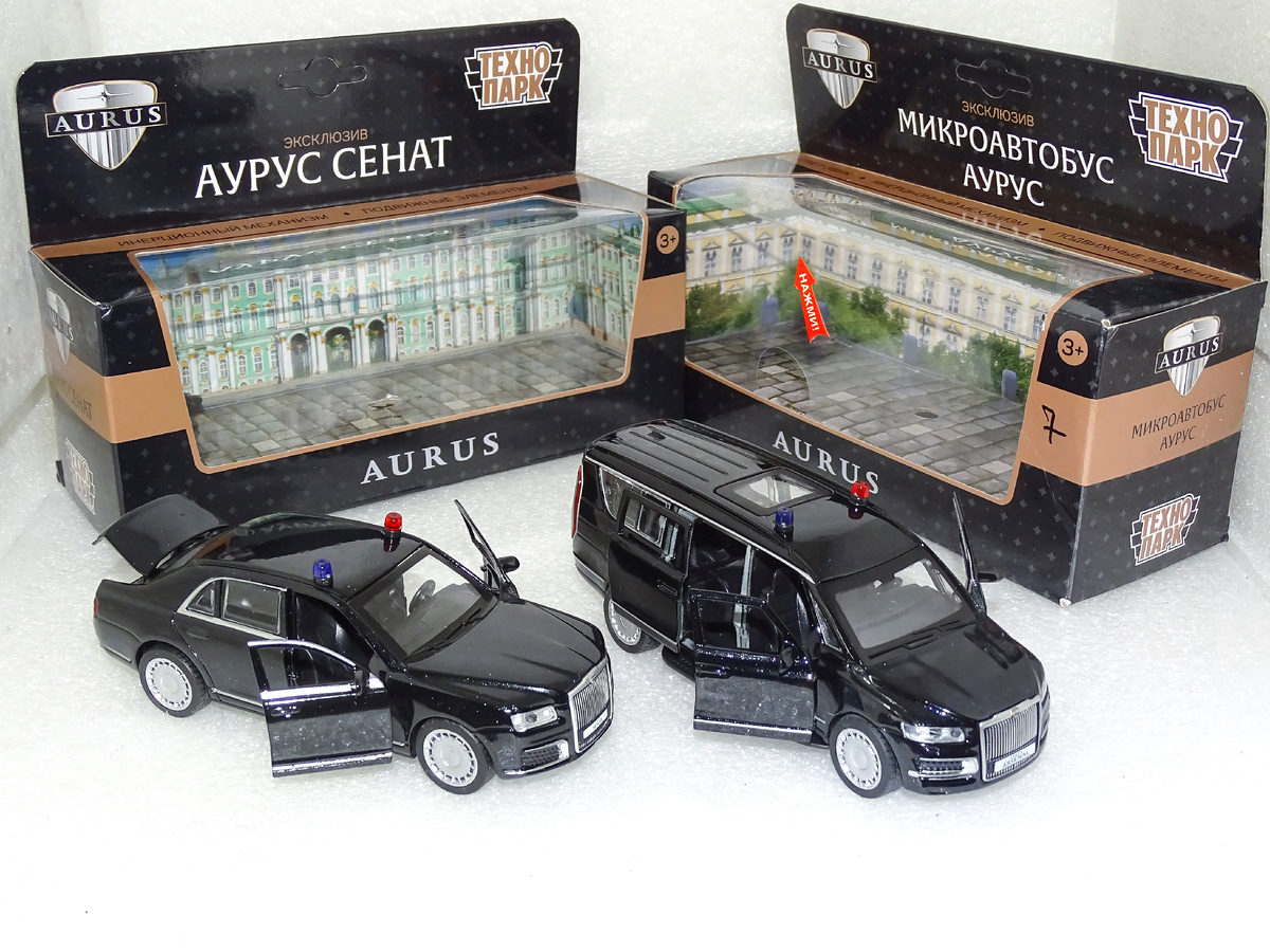 Рис. 1. Модели автомобилей Аурус «Сенат» и Аурус «Арсенал» и фирменные коробочки от «Технопарк»