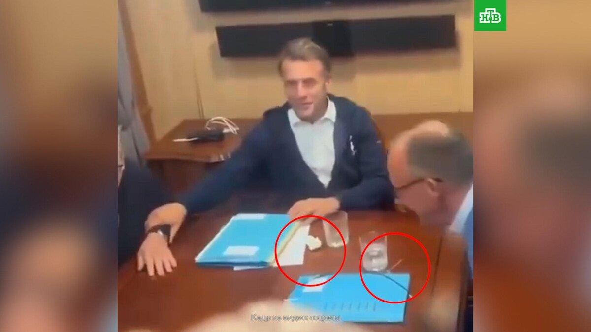    В соцсетях гадают, что Макрон и Мерц быстро убрали со стола при виде прессы