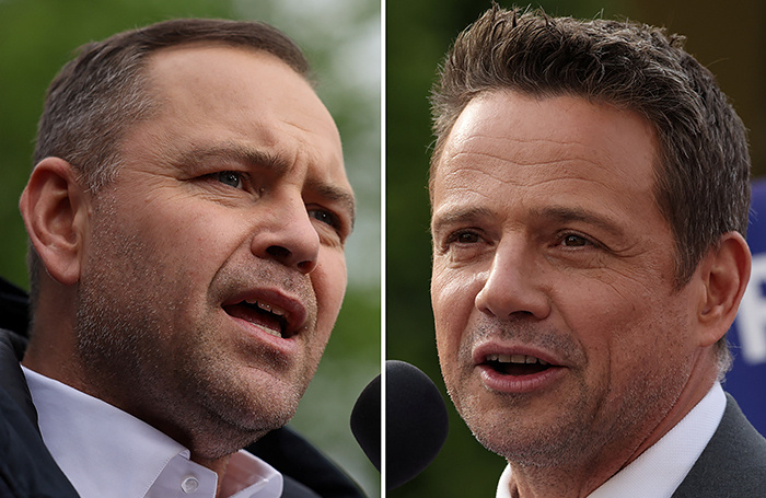    Кандидаты в президенты Польшы Кароль Навроцкий (слева) и Рафал Тшасковский.REUTERS/Kacper Pempel