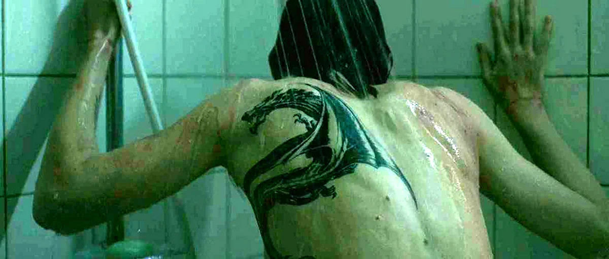Кадр фильма "Девушка с татуировкой дракона", 2011г