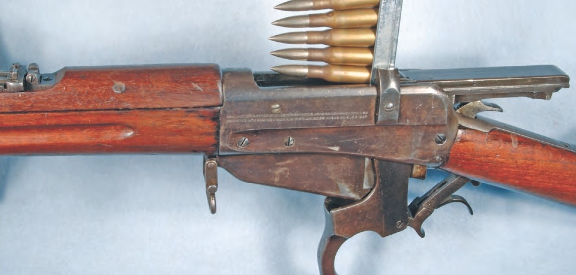 Снаряжение магазина обоймой.