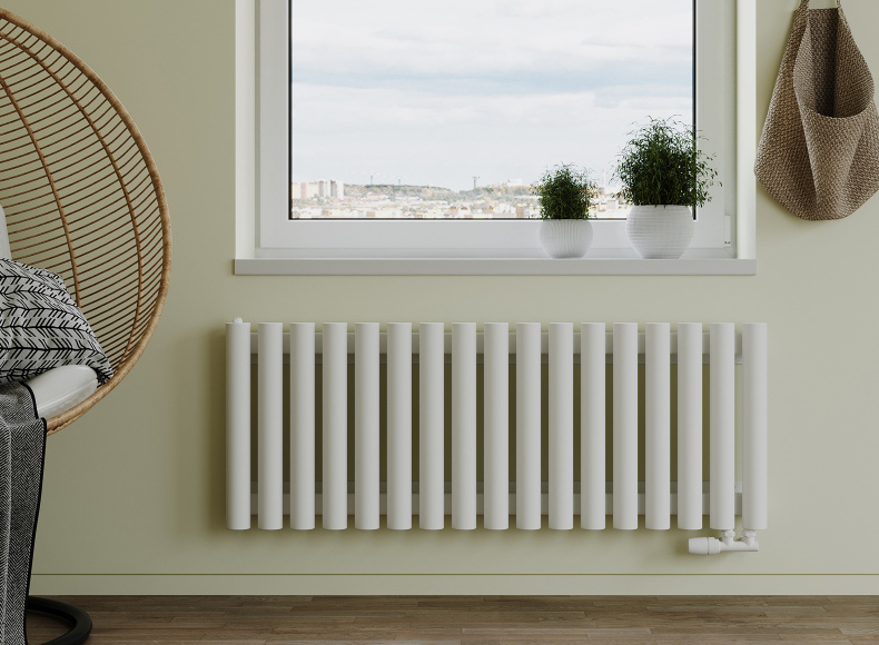 Трубчатый радиатор с нижним правосторонним подключением и термостатическим узлом в цвет радиатора с подключением в стену.