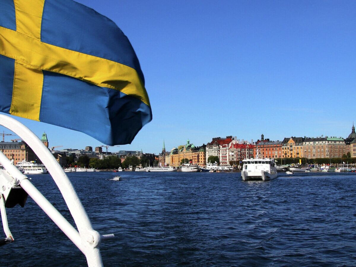    Флаг Швеции в СтокгольмеCC BY-SA 2.0 / Guillaume Baviere / Stockholm. På Saltsjön