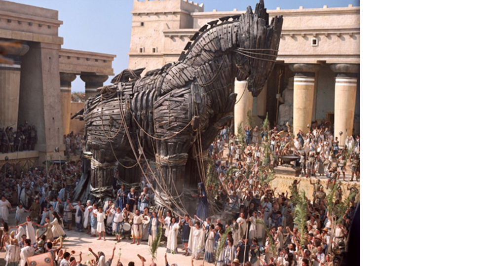 Жители осаждённой Трои с радостью встречают огромного коня