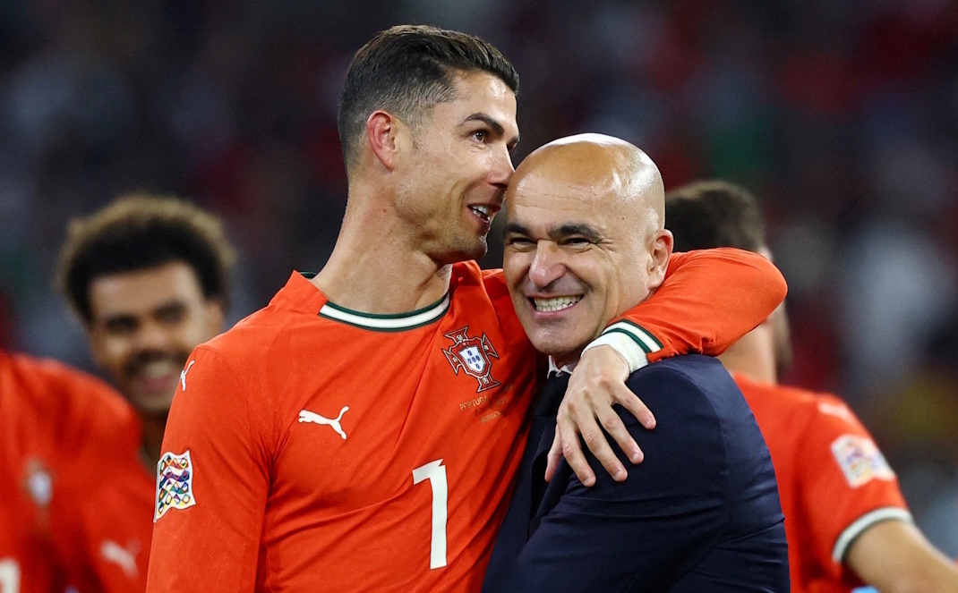    Криштиану Роналду и Роберто Мартинес. Reuters