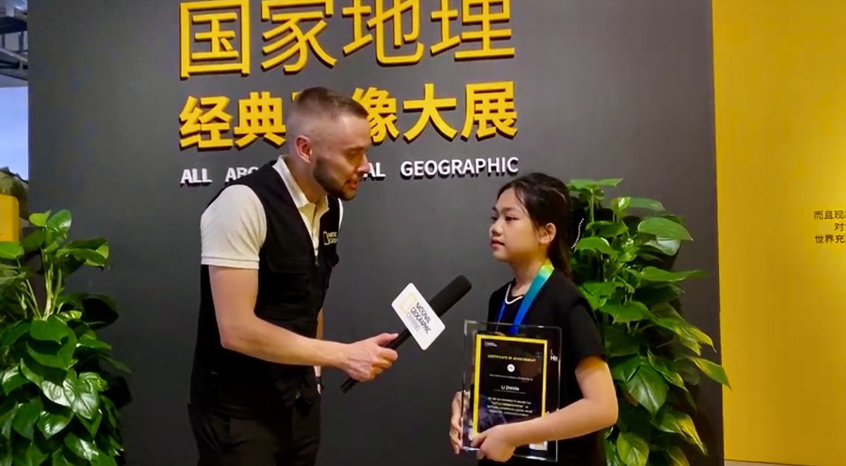  Репортёр на выставке National Geographic