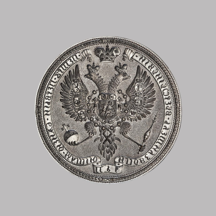 Большая государственная печать Петра I. Россия, XVIII в. Серебро, резьба. Диаметр — 99 мм, высота: 8 мм