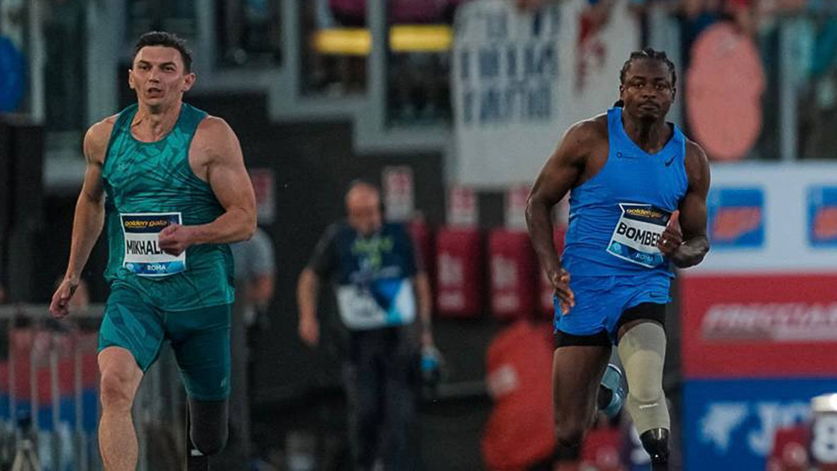    Петр Михальков (слева) занял четвертое место в забеге на 100 метров в классе T64 на этапе «Бриллиантовой лиги» в Риме.Паралимпийский комитет России