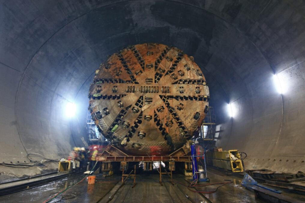 [caption id="attachment_153308" align="alignnone" width="1016"] Tunnel Boring Machine (TBM) )that is being moved inside an underground tunnel.[/caption]