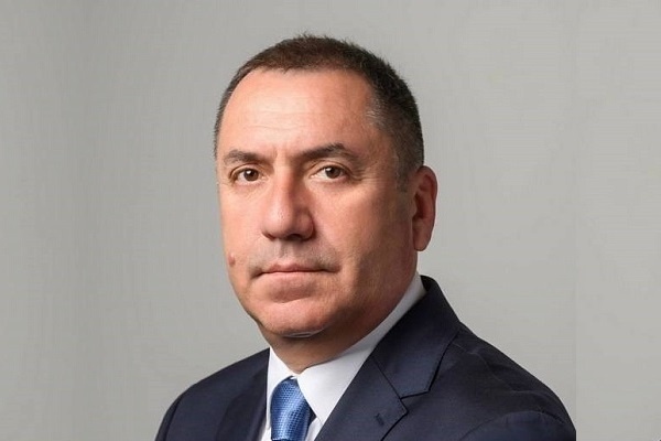    Woman holding a astrology book. Astrological wheel projection, choose a zodiac sign. Astrology esoteric concept. Виталий