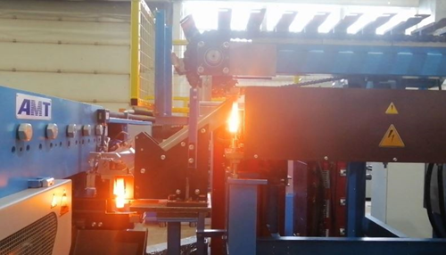 Индукционный нагреватель для зонного нагрева заготовки перед прокаткой в линии поперечно-клиновой прокатки