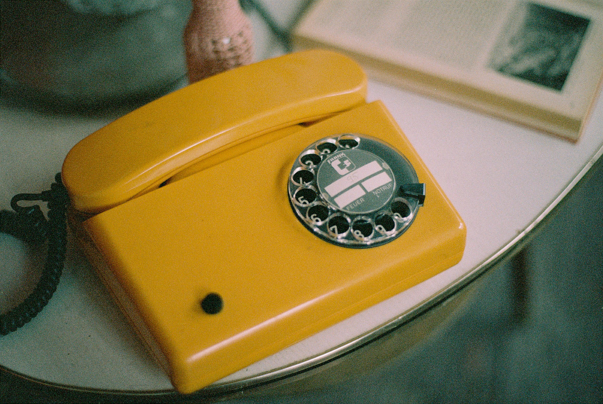Photo by Markus Spiske: https://www.pexels.com/photo/yellow-and-silver-rotary-phone-4389246/