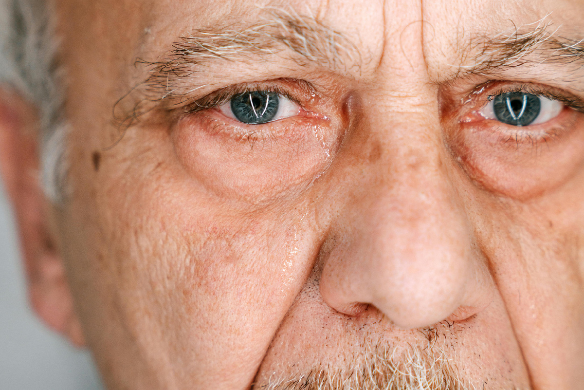 Photo by Ivan Samkov: https://www.pexels.com/photo/close-up-shot-of-an-elderly-man-crying-8964680/