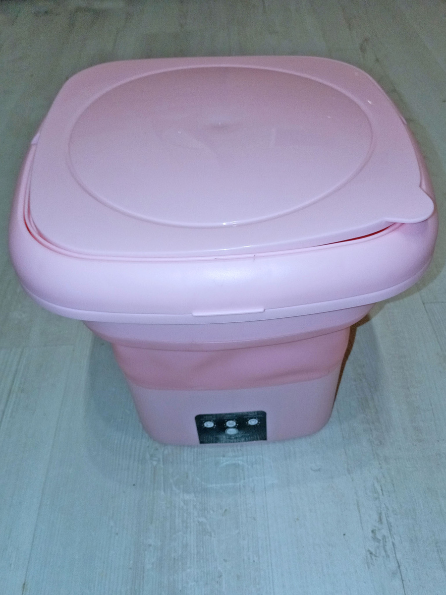 разложенная стиральная машина с крышкой