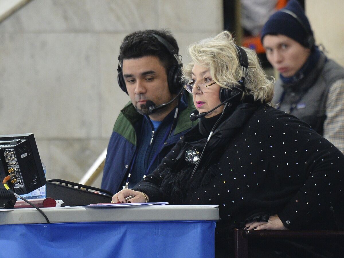    Тренер Татьяна Тарасова и комментатор телеканала "Россия-2" Александр Гришин© РИА Новости / Владимир Песня