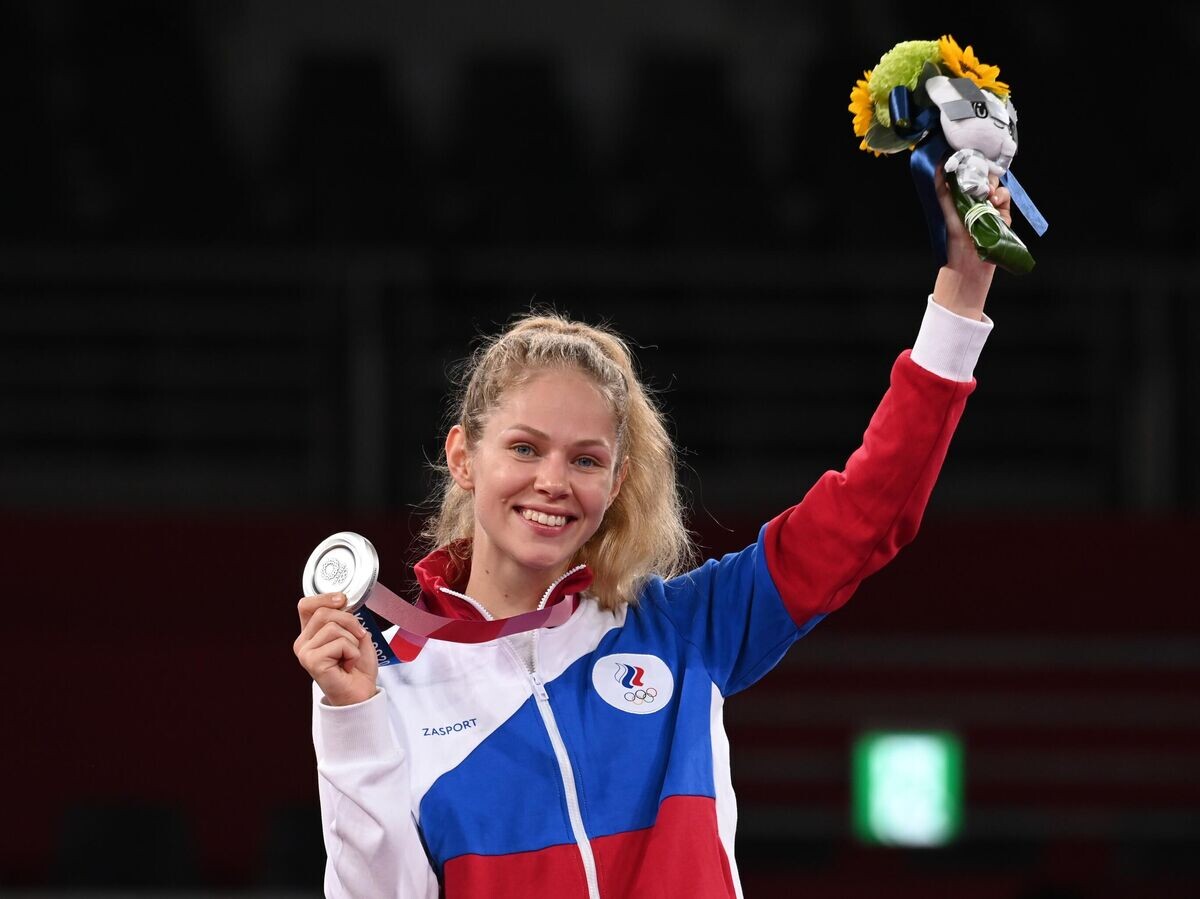    Российская спортсменка, член сборной России (команда ОКР) Татьяна Минина, завоевавшая серебряную медаль на соревнованиях по тхэквондо в весовой категории до 57 кг среди женщин на XXXII летних Олимпийских играх в Токио.© РИА Новости / Григорий Сысоев