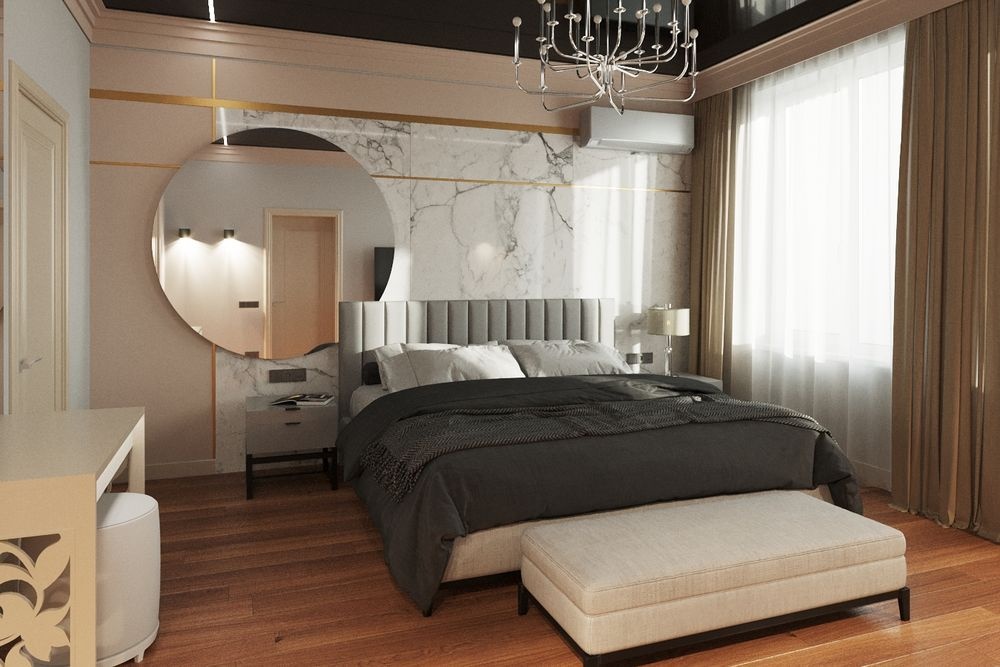    Элегантная акцентная стена в спальне выполнена из крупноформатных плит под мрамор, дополненная декоративными золотыми вставками и круглым зеркалом. Такое решение придает интерьеру роскошный и цельный вид. / Фото: Наталия Иксанова