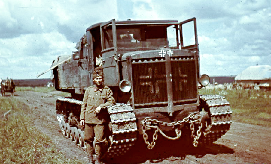 Солдат-мадьяр у трофейного советского тягача "Ворошиловец", 1942 г.