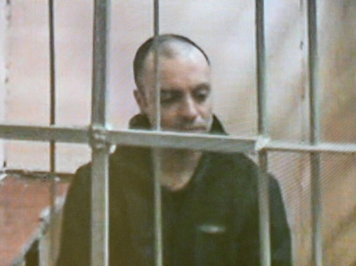    Гражданин России и Италии Руслан Сидики* в режиме видеотрансляции на заседании во Втором Западном окружном военном суде в Москве© РИА Новости / Станислав Красильников