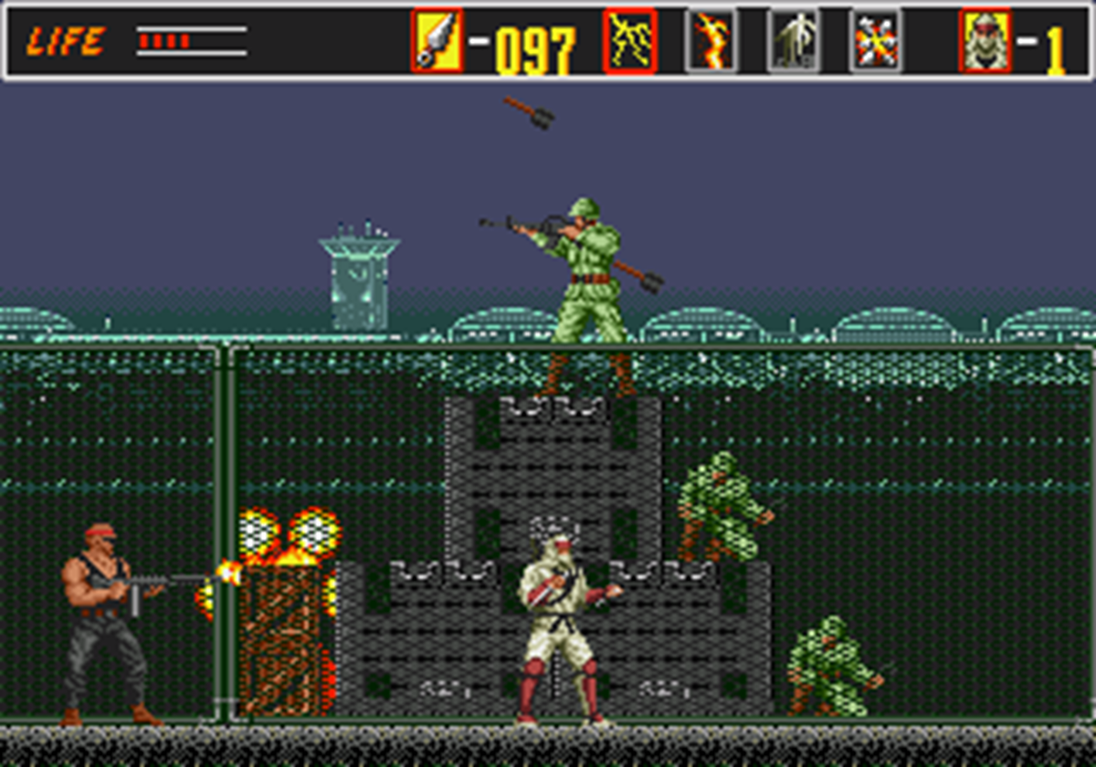 Аванпост на заднем плане (в другой плоскости, в которую двойным прыжком мы можем переместиться). Скриншот. The Revenge of Shinobi. 1989 год. Разработчик: Sega.