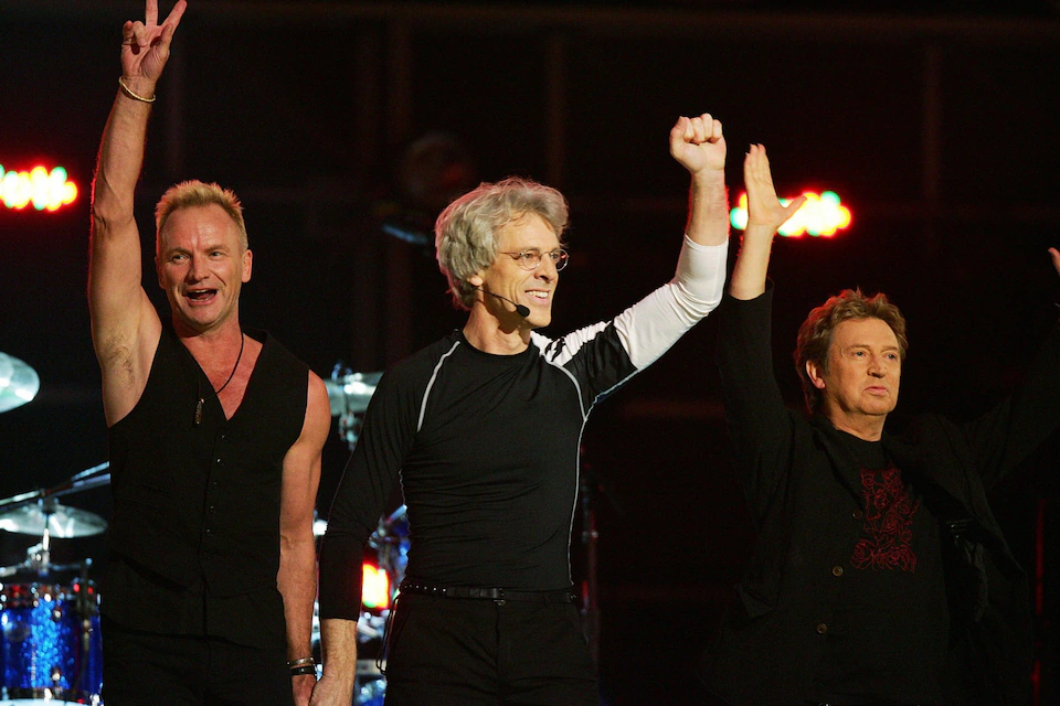 Стюарт Коупленд (в центре): «Когда мы играем эти песни, они наполнены двумя десятилетиями жизни людей» (The Police на сцене в 2007 году) Фото: Робин Бек/AFP/Getty