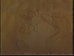 Камень с изображением щюки которая гонится за рыбой