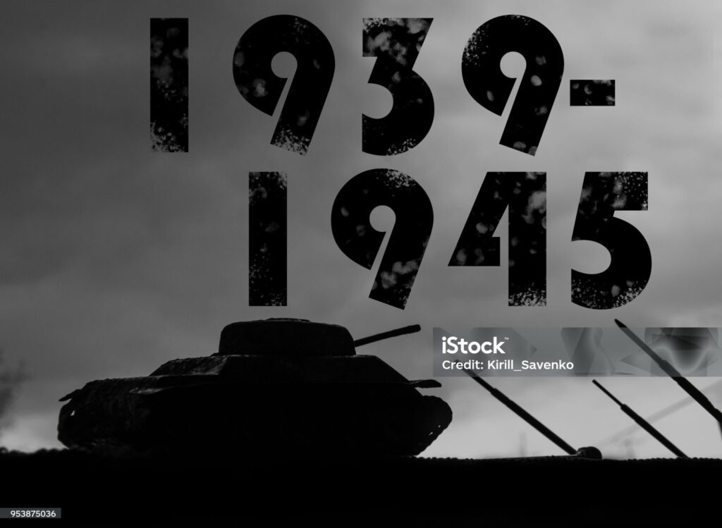    Silhouette of a tank against a background of dark clouds sky. The Second World War. 1939-1945. 9-th of May. Great Victory Day Редакция газеты