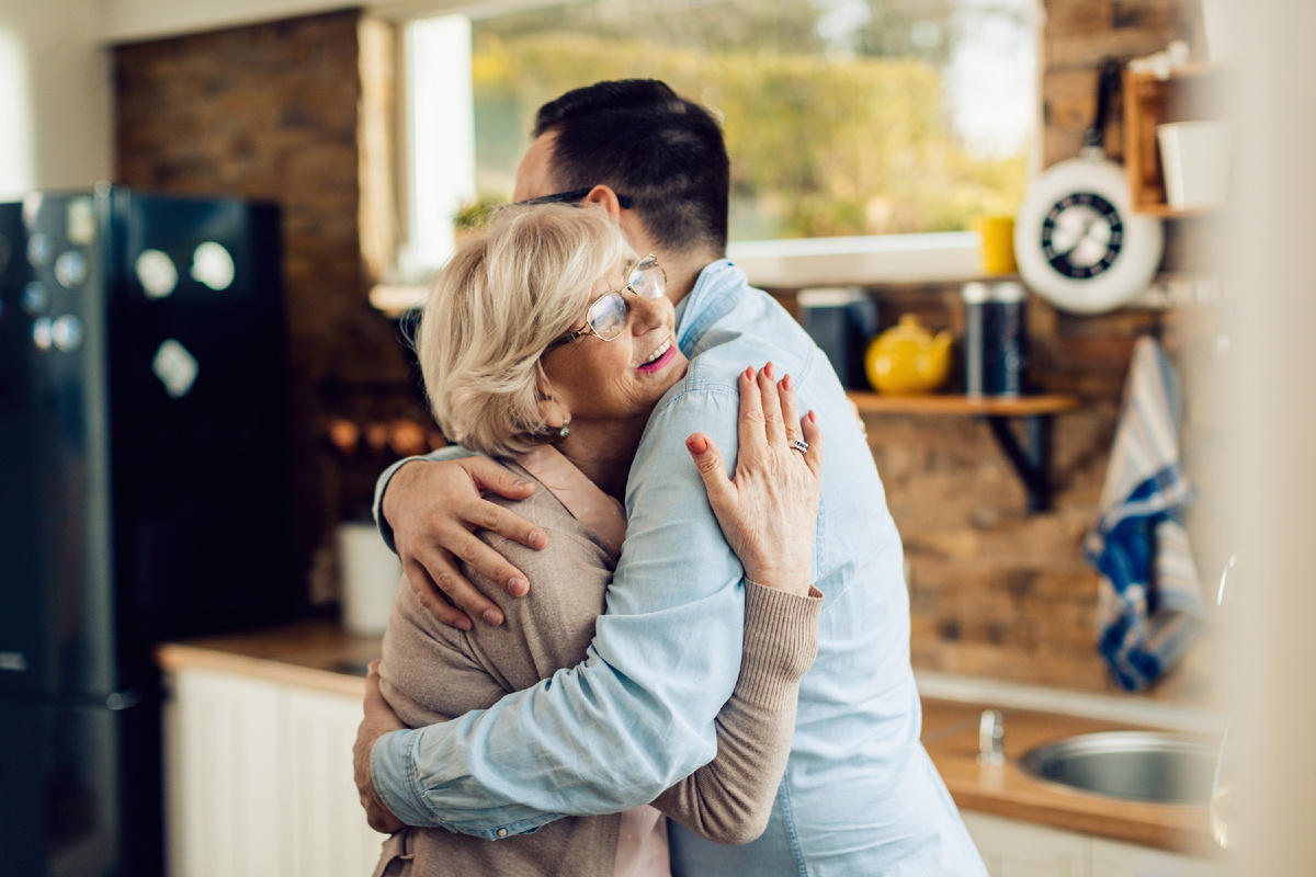 <a href="https://www.freepik.com/free-photo/happy-mature-woman-her-adult-son-embracing-kitchen_25776952.htm">Image by Drazen Zigic on Freepik</a>