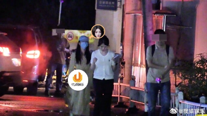    Сюй Лиша у полицейского участка