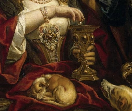 Якоб Йорданс, «Пир Клеопатры». 1653 год. Холст, масло. 156,4 × 149,3 см. Фрагмент. Государственный Эрмитаж, Санкт-Петербург. Собачка, спящая на коленях героини, кстати, символизирует греховную невоздержанность, неподобающую гречанке древнего рода, да еще царице. 