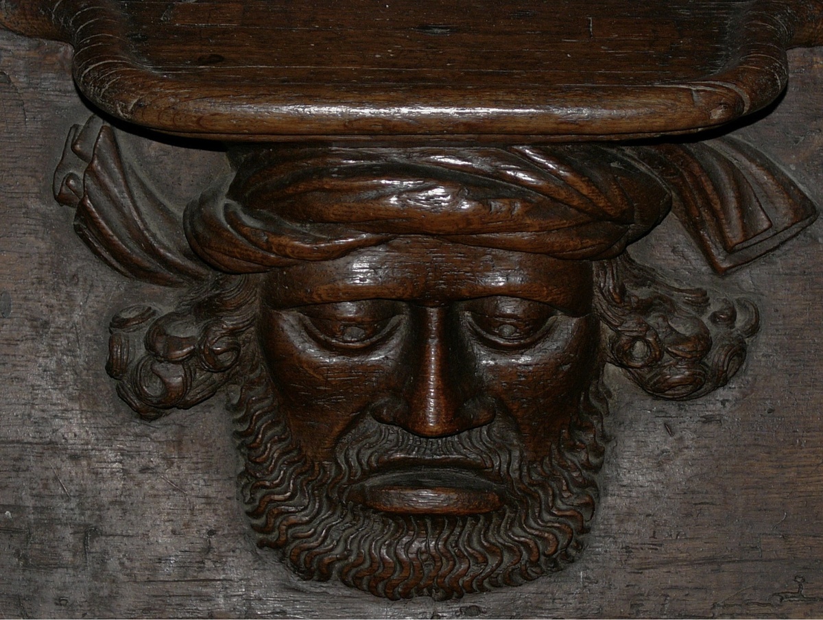 Мизерикорд «Хмурый человек». XV век. Резьба по дереву. Аббатство св.Троицы, Вандом, Франция. 