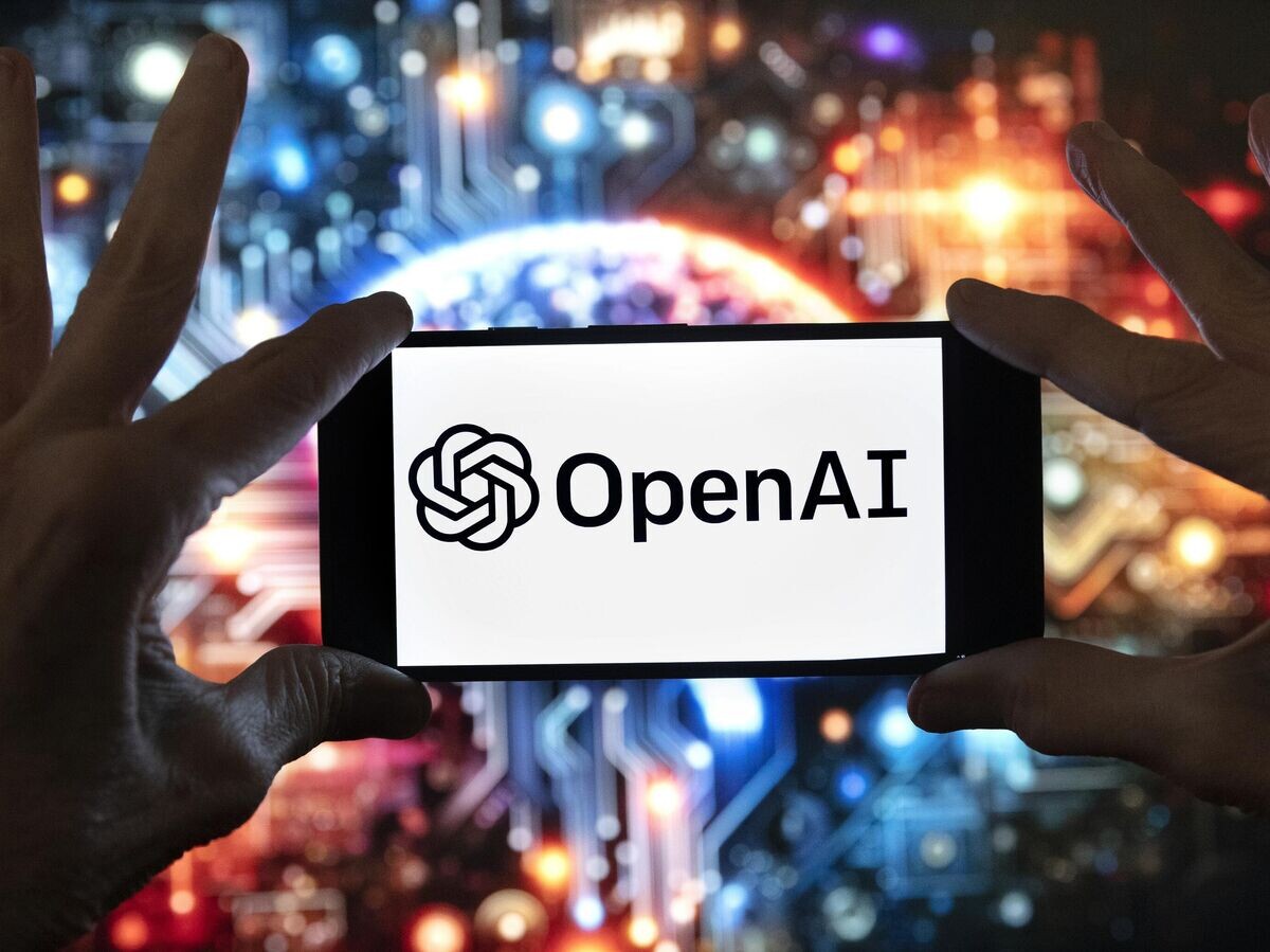    Логотип OpenAI на экране мобильного телефона© AP Photo / Michael Dwyer