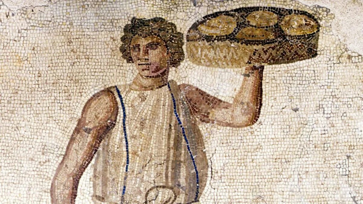 Два хлеба вон тому столику.